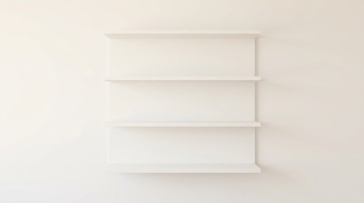 Four empty horizontal wooden display ledges attached to a plain off-white wall.