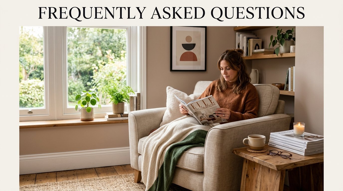Young woman sits in a beige armchair with a textured throw blanket, reading a magazine by a sunlit window.